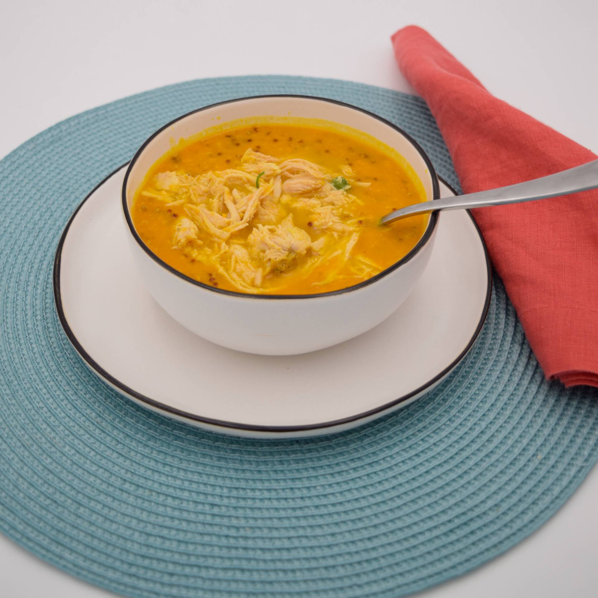 Butternut squash soup with quinoa and shredded chicken