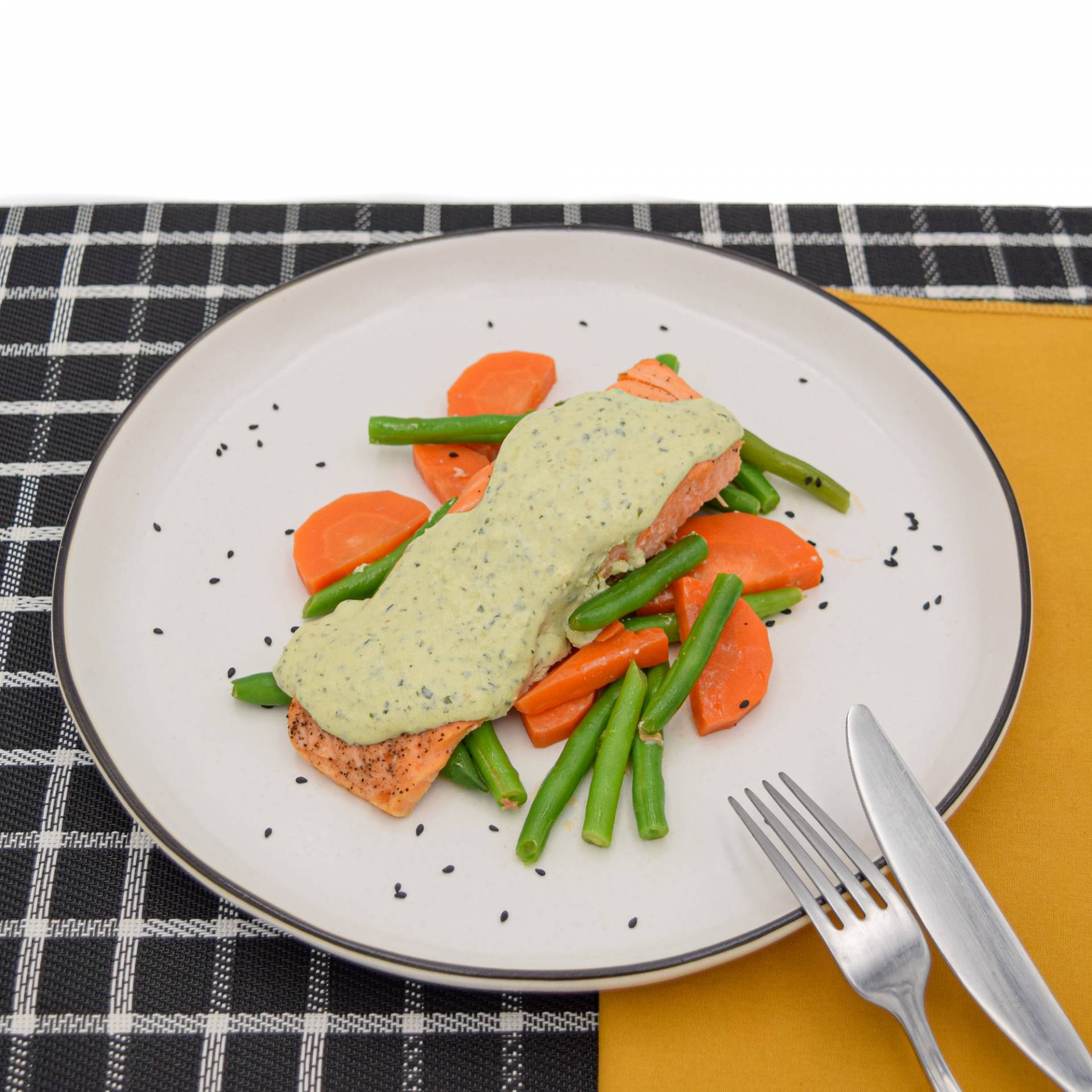 Baked salmon with creamy pesto and mixed vegetables